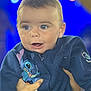 Dawson Tarlet participe au concours pour gagner de l'argent avec cette photo : baby, blue_eyes, bokeh, child, closeup, clothing, colorful_background, cute, expression, face, hands, holding, hoodie, indoor, infant, navy_blue, portrait, smiling, stitch_character, young_child
