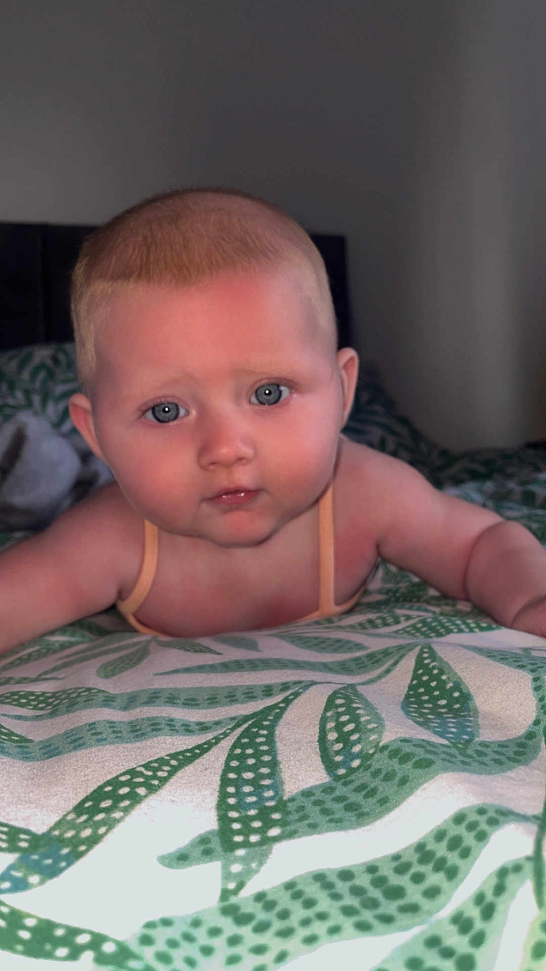 Maizey-May is registered to the contest to win money with this photo: baby, infant, child, face, blue_eyes, skin, hair, blanket, pattern, bed, indoor, portrait, cute, young, lying_down, expression, human, person, soft_lighting, close_up