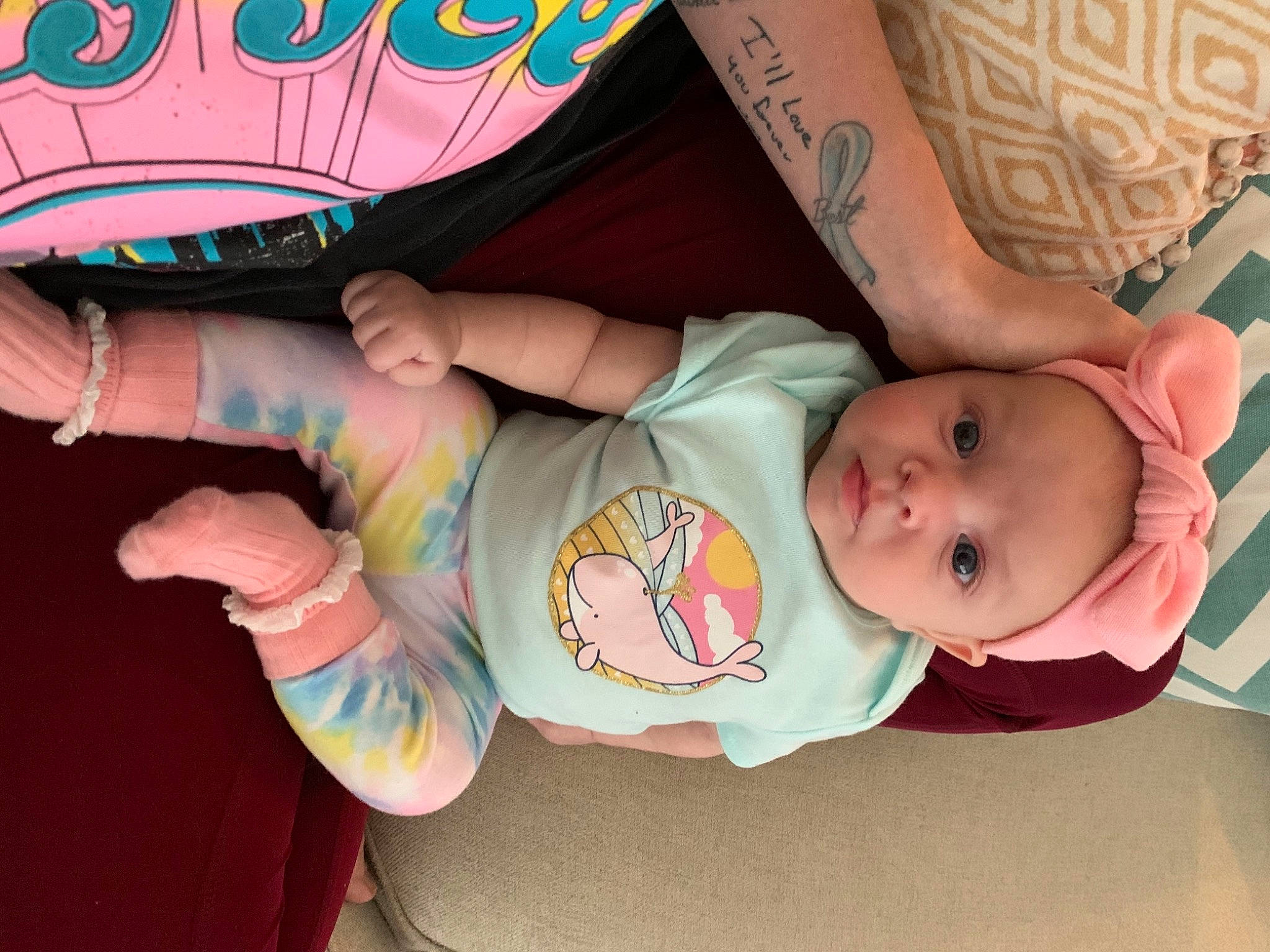 Skylar is registered to the contest to win money with this photo: baby, baby_products, baby_toddler_clothing, cheek, child, comfort, facial_expression, finger, foot, gesture, happy, leg, mouth, nail, person, pink, skin, thigh, thumb, toddler