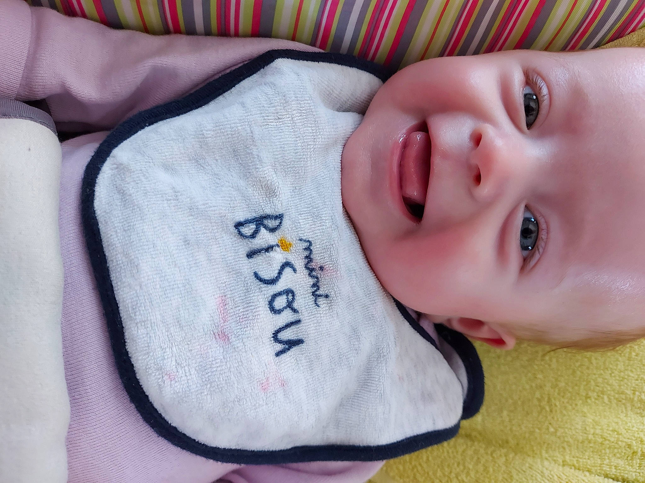 Ambre participe au concours pour gagner de l'argent avec cette photo : baby, baby_products, baby_toddler_clothing, carmine, cheek, child, comfort, eyebrow, eyelash, finger, happy, iris, lip, nose, person, pink, portrait_photography, skin, sleeve, smile