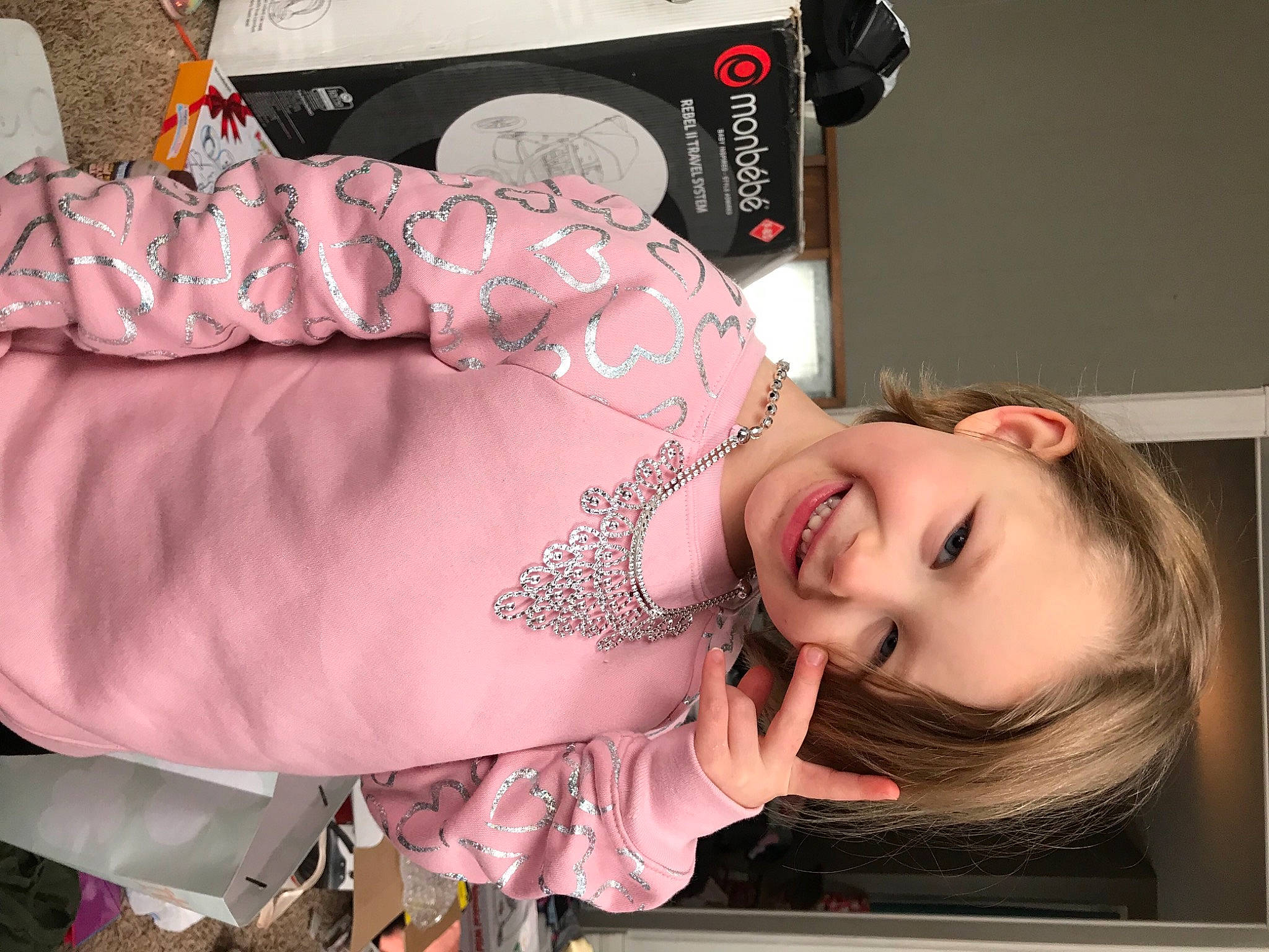 Renesmee is registered to the contest to win money with this photo: audio_equipment, baby, baby_products, bracelet, child, eyelash, fashion_accessory, flash_photography, flesh, happy, home_appliance, jewellery, joy, mouth, person, pink, portrait_photography, room, sitting, skin