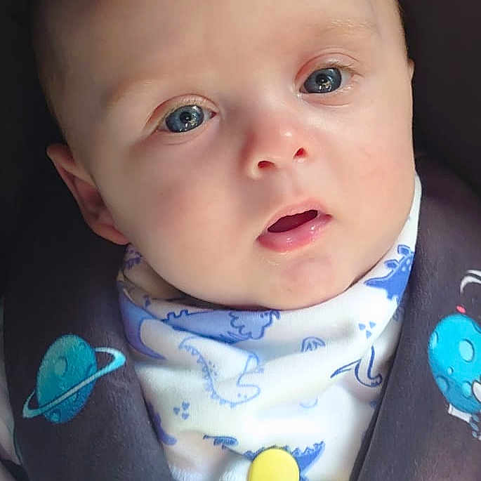 Leonardo Apollo is registered to the contest to win money with this photo: baby, car, car_interior, carseat, clothing, coat, cushion, cutlery, face, hat, head, homedecor, jacket, newborn, person, photography, portrait, spoon, stroller, toy