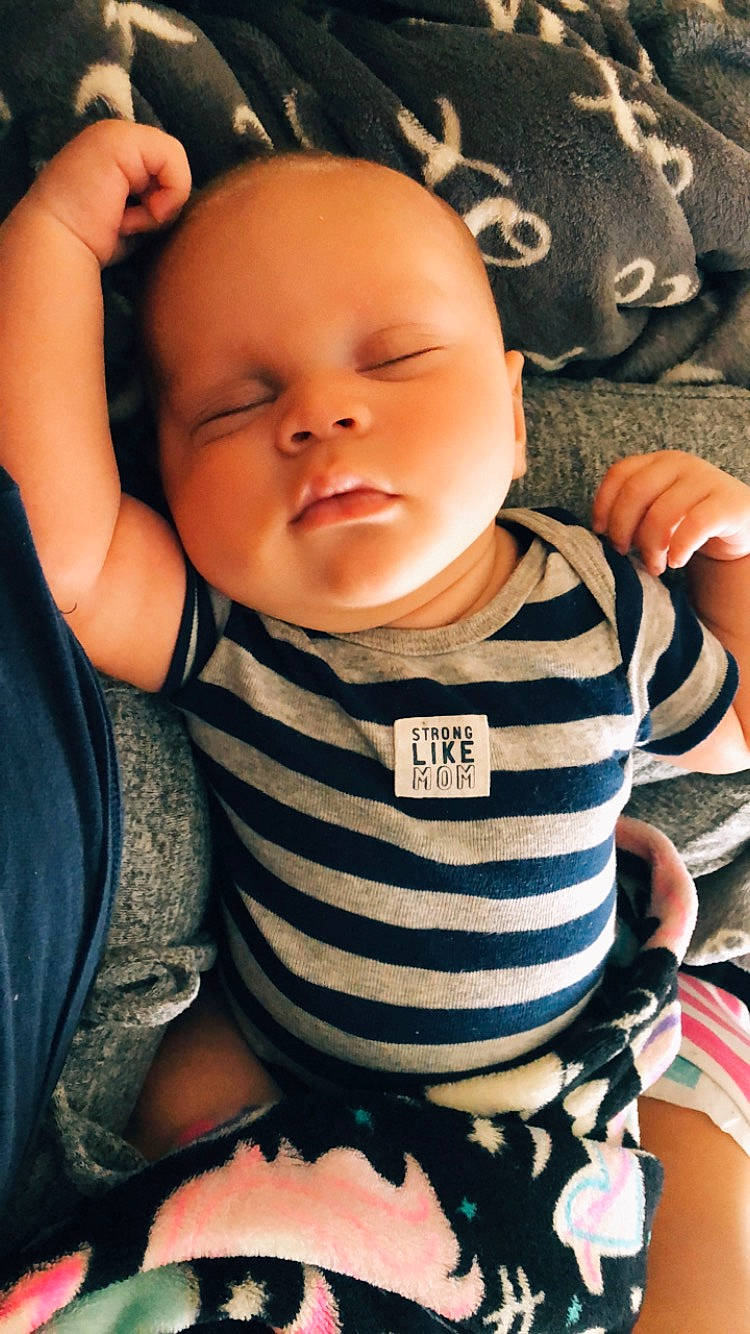 Souleymane is registered to the contest to win money with this photo: arm, baby, cheek, child, cool, face, finger, gesture, hand, head, mouth, nose, person, skin, smile, thumb, toddler