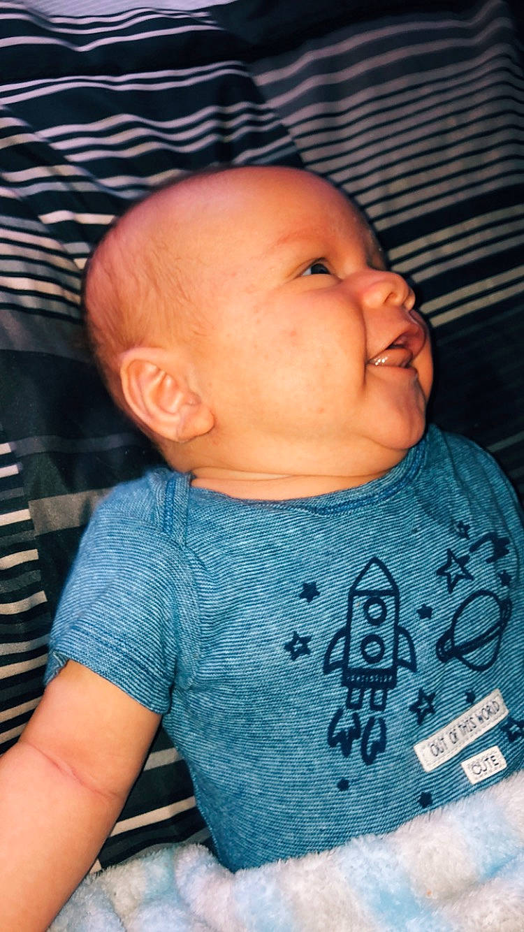 Souleymane is registered to the contest to win money with this photo: baby, blue, cheek, child, chin, face, forehead, head, lip, mouth, nose, person, skin, sleep, toddler