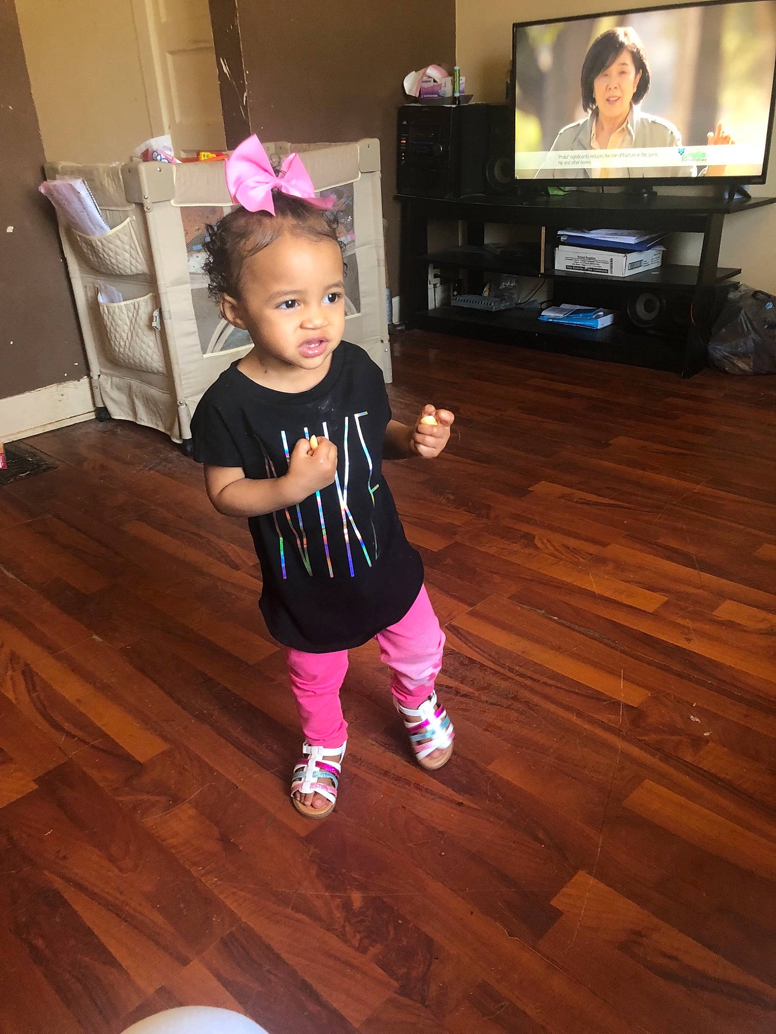 Khadija joined the competition — help win amazing prizes! child, floor, flooring, footwear, hardwood, joint, laminate_flooring, leg, leggings, person, pink, shoe, shoulder, standing, toddler, wood, wood_flooring