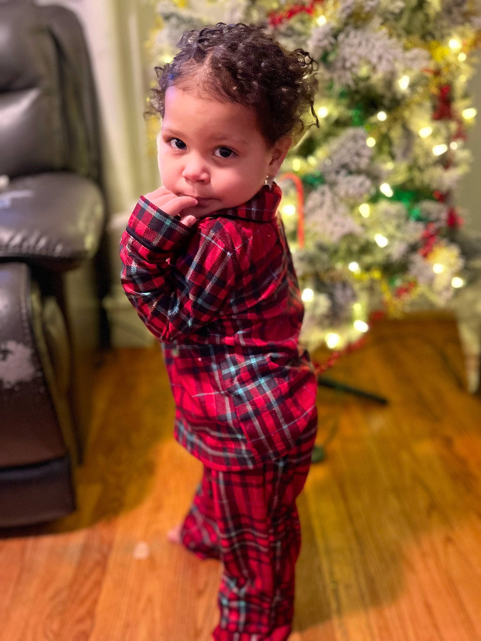 Alina joined the competition — help win amazing prizes! baby, baby_toddler_clothing, child, christmas_ornament, christmas_tree, event, face, flooring, fun, happy, head, pattern, person, plaid, plant, sleeve, standing, tartan, toddler, tree