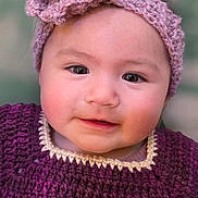 Jiya joined the competition — help win amazing prizes! apparel, baby, child, closeup, clothing, crochet, cute, face, flower, headband, indoor, infant, knitwear, person, portrait, purple, smile, soft, warm, young
