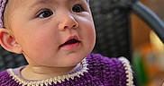 Jiya joined the competition — help win amazing prizes! baby, child, closeup, colorful, crochet, curious, cute, expression, face, headband, indoor, infant, playful, portrait, purple_clothing, sitting, smiling, soft_light, toy, young_child