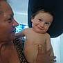 Rey is registered to the contest to win money with this photo: toddler, child, adult, woman, indoor, smile, holding, affection, family, love, face, person, shirtless, happy, closeup, portrait, skin, hand, head, candid