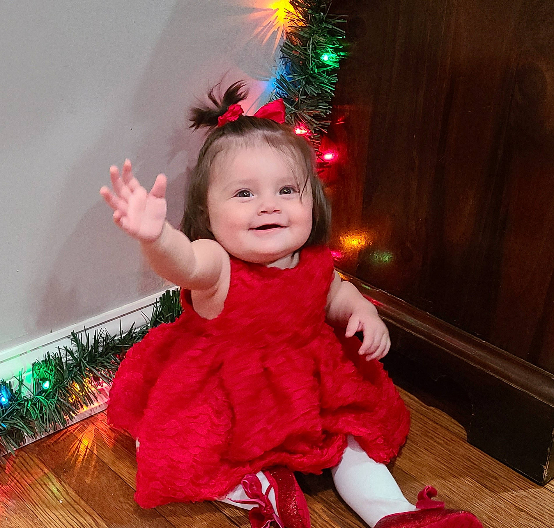 Ramsey is registered to the contest to win money with this photo: baby_toddler_clothing, child, christmas, christmas_decoration, christmas_ornament, christmas_tree, event, flash_photography, fun, happy, holiday, human_body, joy, light, lighting, ornament, person, pink, purple, sleeve