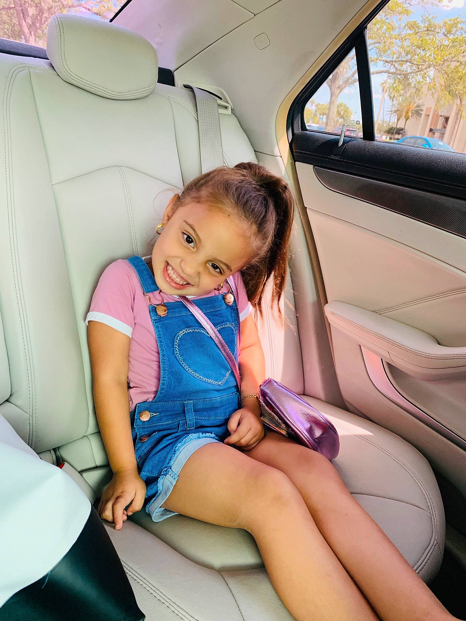 Jade Arias joined the competition — help win amazing prizes! auto_part, baby_in_car_seat, car, car_seat, car_seat_cover, child, driving, family_car, head_restraint, joy, leg, luxury_vehicle, mid_size_car, neck, person, plant, seat_belt, toddler, vacation, vehicle