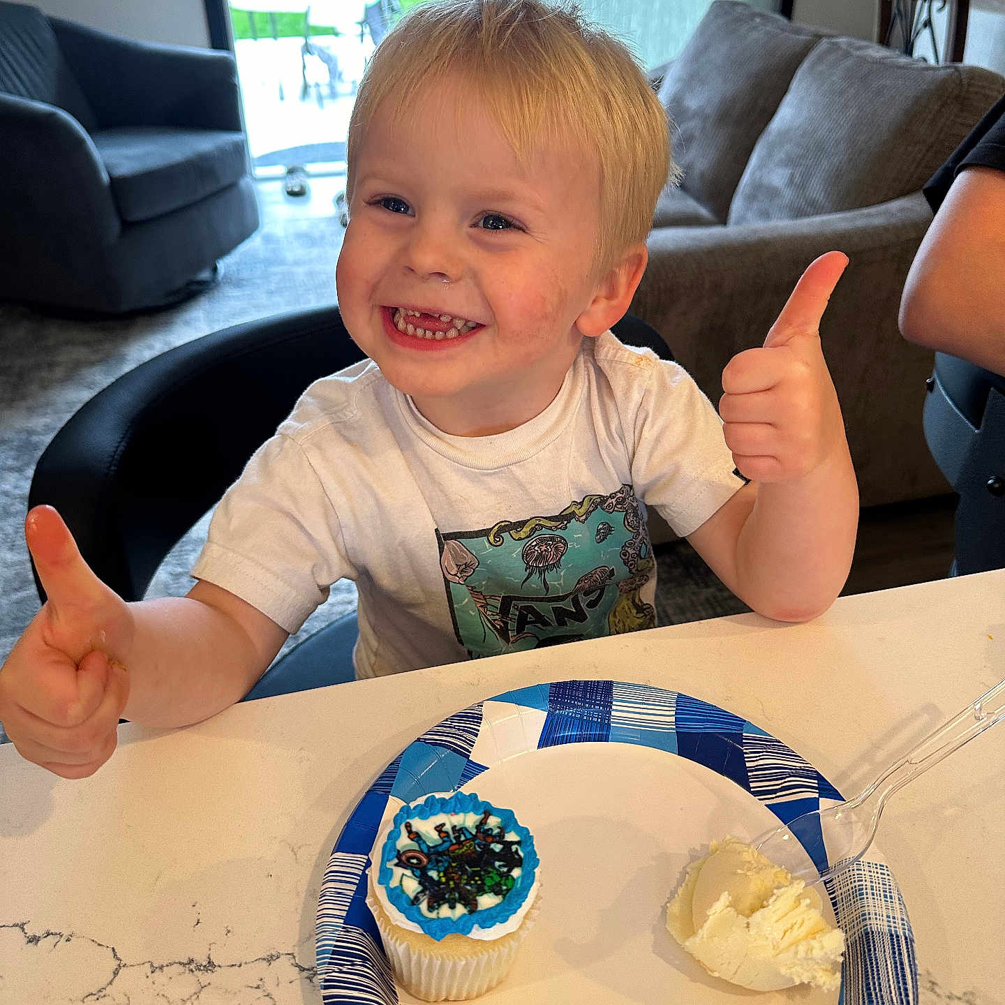 Brodie is registered to the contest to win money with this photo: architecture, bodypart, building, couch, cream, dessert, face, finger, food, furniture, hand, head, icing, indoors, livingroom, person, photography, portrait, room, table