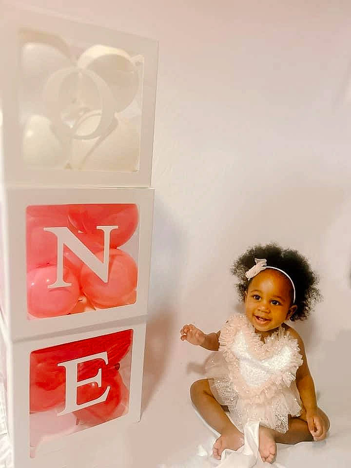 Treasure is registered to the contest to win money with this photo: baby_toddler_clothing, carmine, doll, fashion_design, font, happy, joy, one_piece_garment, packaging_and_labeling, person, plastic, smile, symbol, toy, transparency