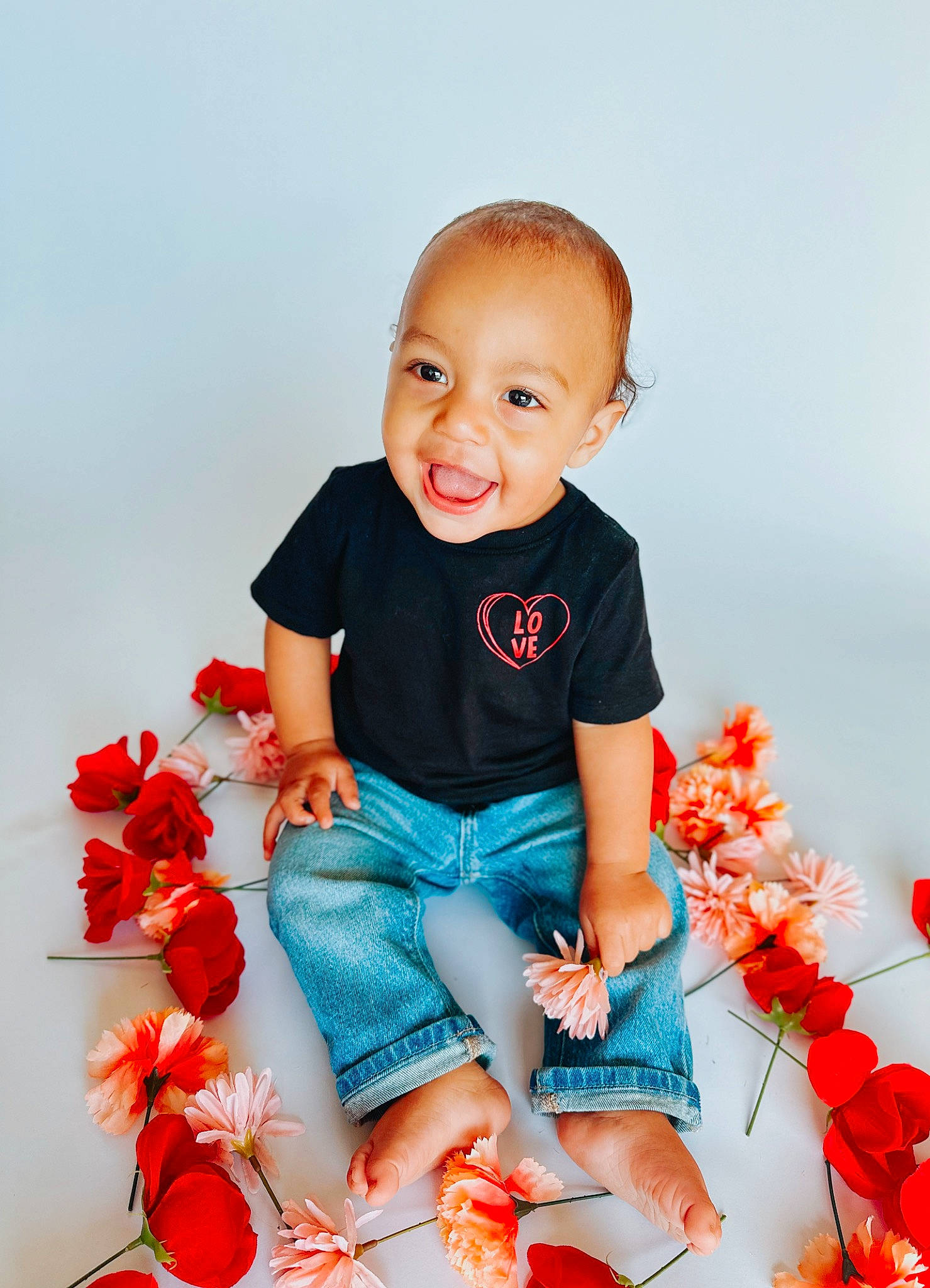 Colson is registered to the contest to win money with this photo: baby_toddler_clothing, beauty, child, electric_blue, facial_expression, flower, happy, jeans, joy, orange, people, people_in_nature, person, petal, pink, plant, product, sleeve, smile, standing