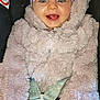 baby, baby_accessory, bow, car_seat, child, closeup, clothing, cute, fluffy_jacket, happy, harness, headband, indoor, infant, pacifier, person, portrait, safety, seatbelt, smiling