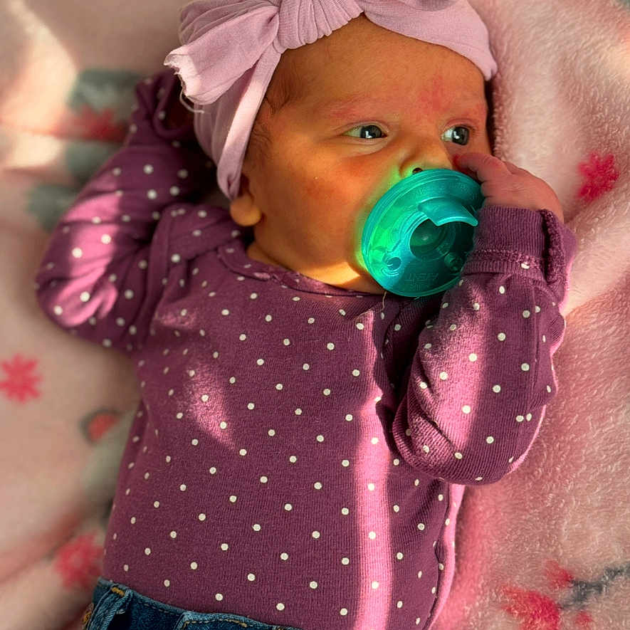 Rose joined the competition — help win amazing prizes! accessories, baby, bodypart, bonnet, cap, clothing, face, finger, glove, hand, hat, head, jeans, newborn, pants, pattern, person, photography, portrait, purple