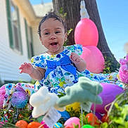 Nyomi joined the competition — help win amazing prizes! blue_bow, celebration, child, colorful, easter_eggs, flower_dress, grass, happy, holiday, nature, outdoor, person, playful, plush_toys, portrait, smiling, spring, sunny_day, toddler, tree