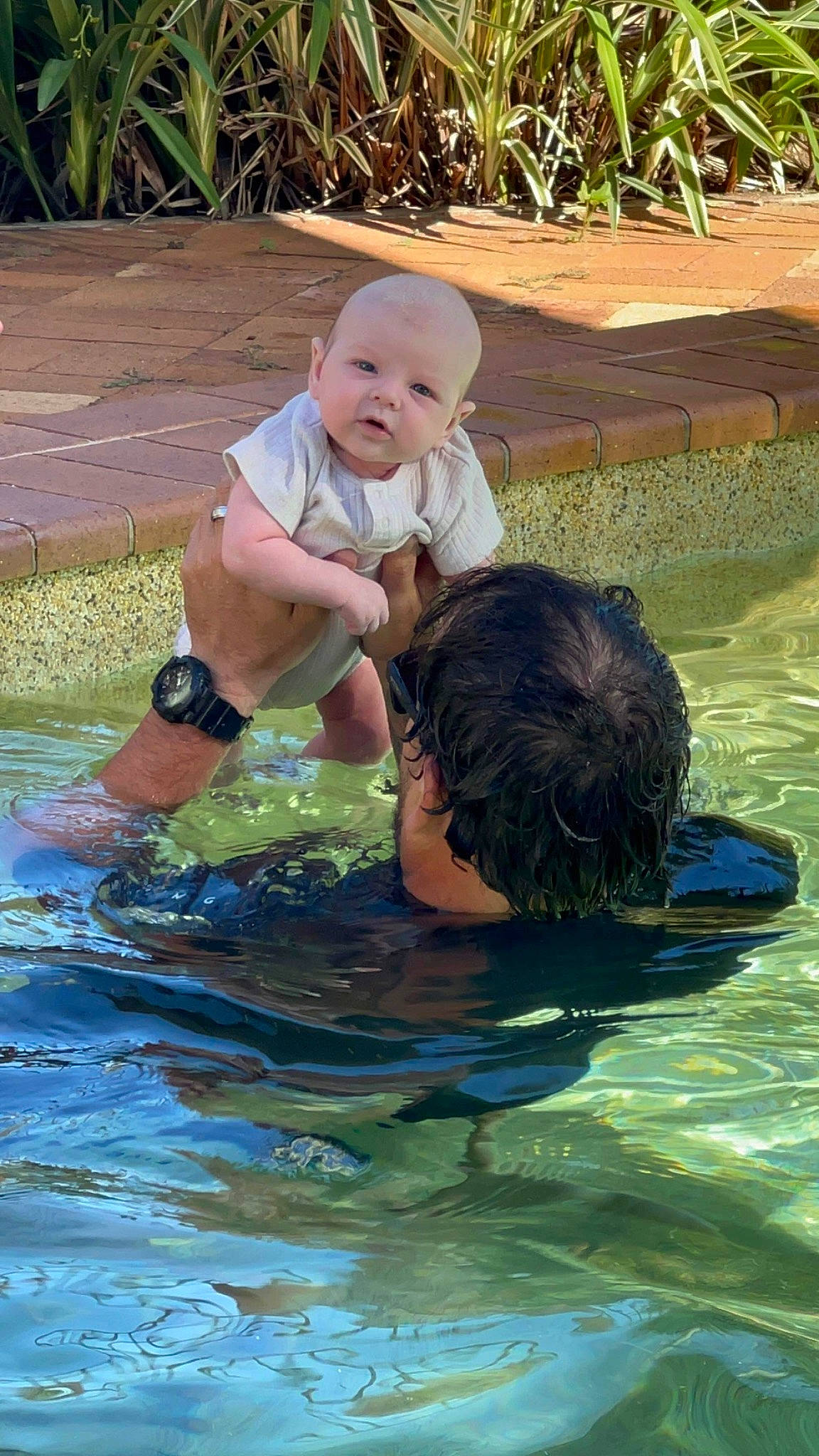 Bowie is registered to the contest to win money with this photo: baby, baby_toddler_clothing, bathing, child, fun, garden, grass, happy, hat, leisure, mammal, people_in_nature, person, plant, play, recreation, sitting, toddler, vacation, vertebrate