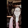 woman, cat, black_cat, glasses, smiling, long_hair, indoor, chair, person, pet, furniture, happy, portrait, home, casual, seated, cute, animal, friendship, light