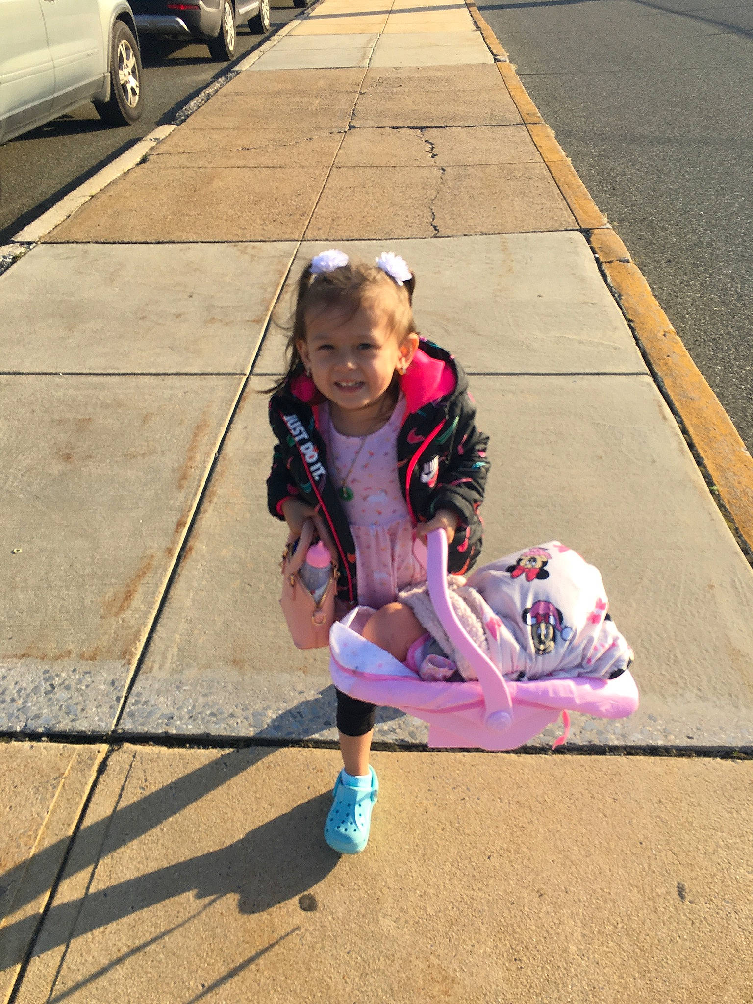 Reign is registered to the contest to win money with this photo: asphalt, child, city, flooring, fun, grass, happy, joy, leisure, magenta, pedestrian, person, recreation, road, road_surface, shoe, sidewalk, sitting, smile, sneakers