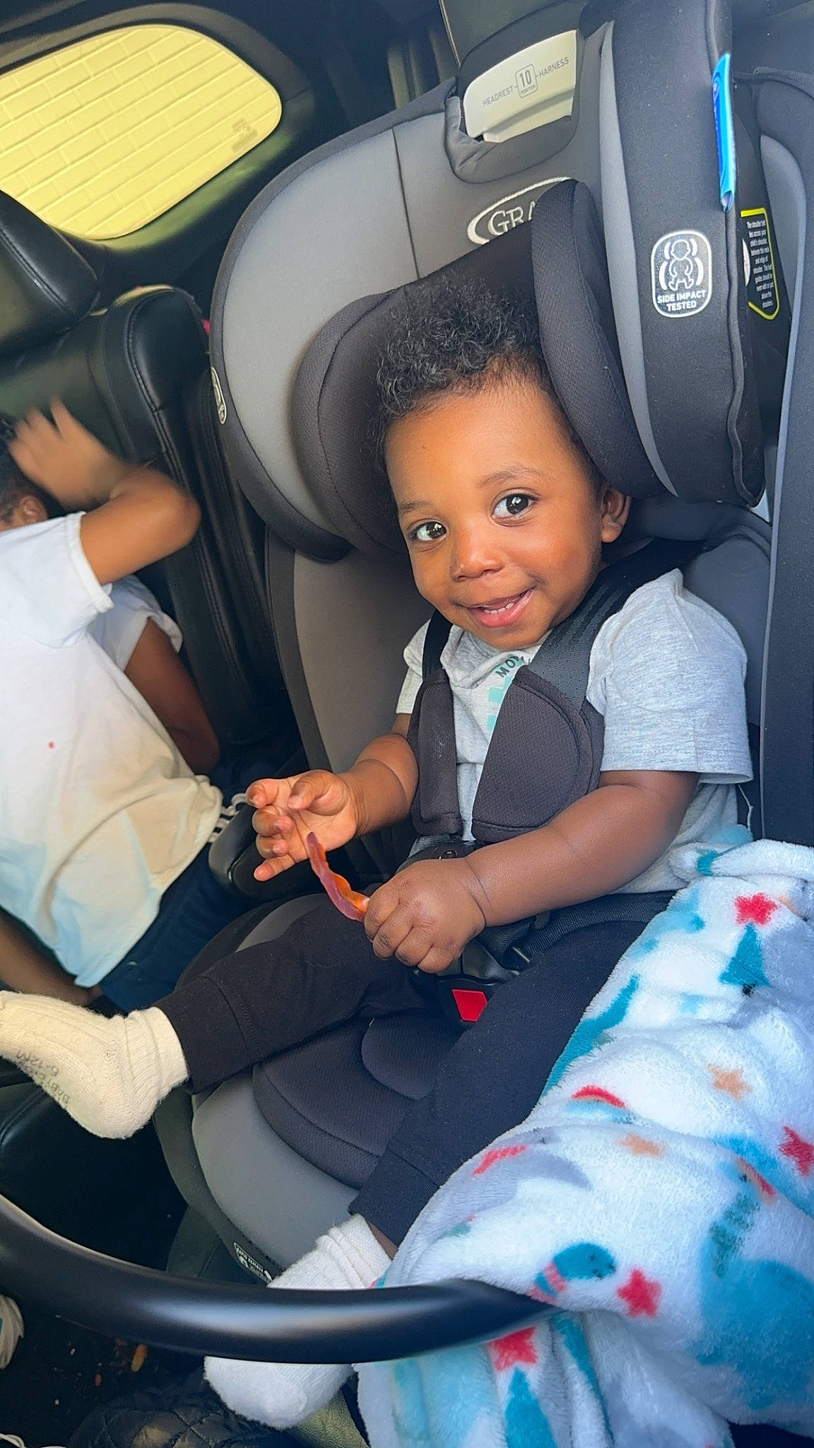 Juelz Smith is registered to the contest to win money with this photo: auto_part, automotive_design, baby_carriage, car_seat, car_seat_cover, child, comfort, electric_blue, family_car, head_restraint, luxury_vehicle, mode_of_transport, motor_vehicle, person, personal_luxury_car, product, seat_belt, smile, toddler, vehicle