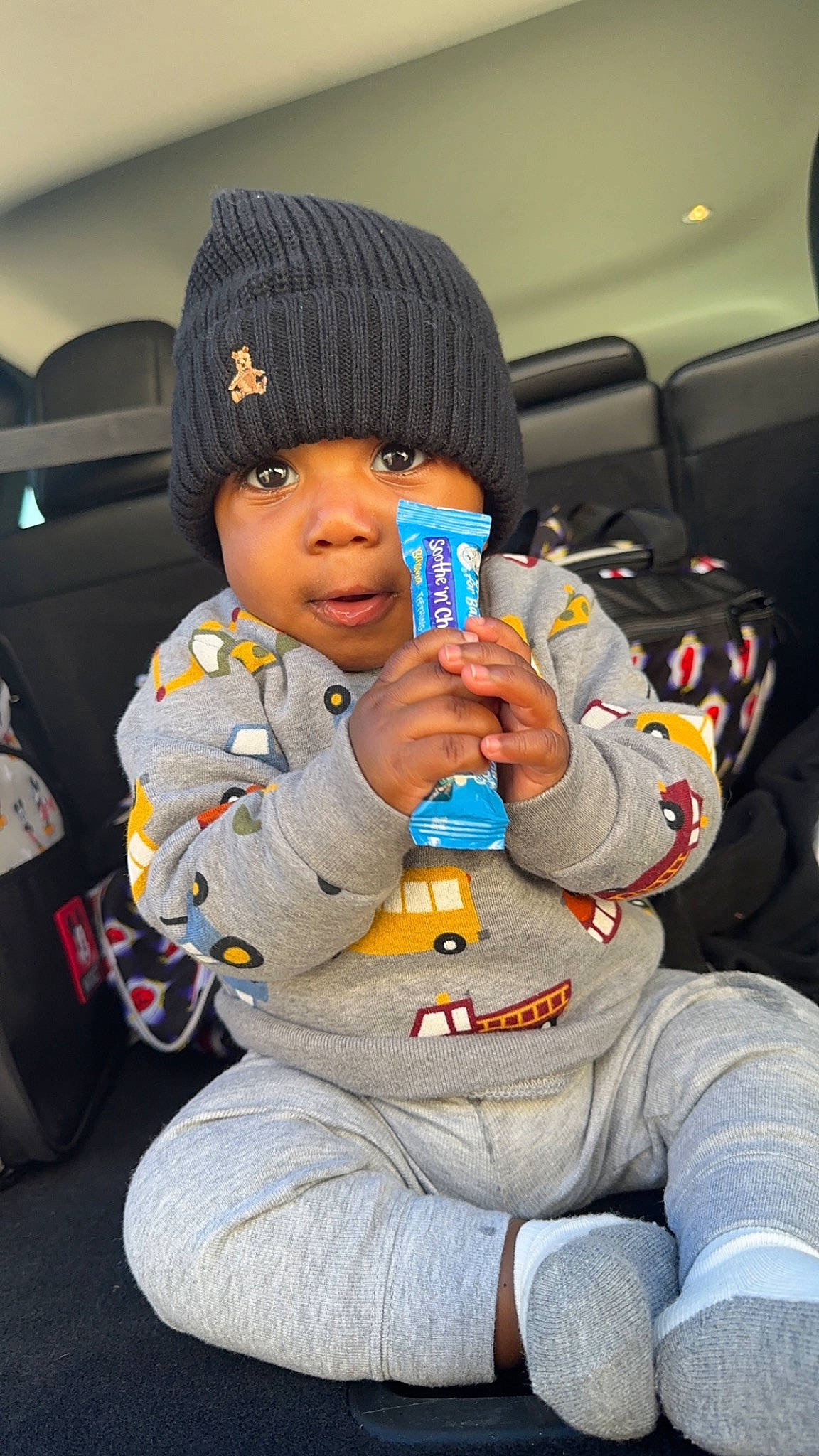 Juelz Smith is registered to the contest to win money with this photo: auto_part, automotive_design, beanie, cap, car_seat, car_seat_cover, child, comfort, family_car, fun, head_restraint, headwear, knit_cap, lap, luxury_vehicle, motor_vehicle, person, sitting, thumb, toddler