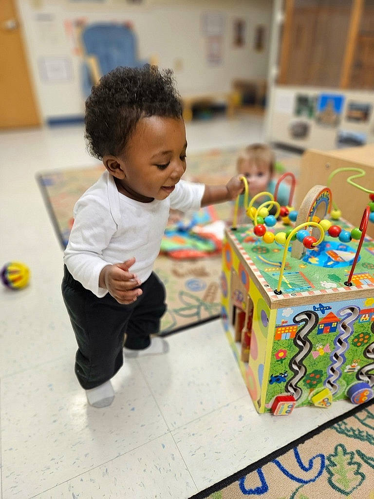 Juelz Smith is registered to the contest to win money with this photo: baby, ball, box, child, confectionery, event, flooring, fun, happy, leisure, person, play, recreation, room, smile, sports_toy, sweetness, toddler, visual_arts, wood