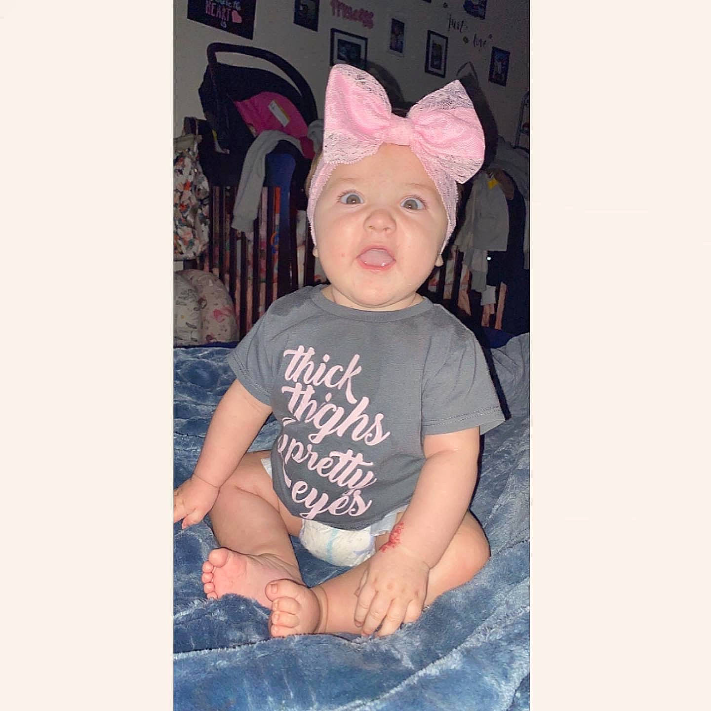 Avyanna is registered to the contest to win money with this photo: child, cool, costume_accessory, ear, head, headgear, human_body, organ, person, pink, t_shirt, toddler