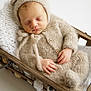 Reuben is registered to the contest to win money with this photo: baby, newborn, child, sleeping, knit_hat, knit_outfit, basket, blanket, cozy, portrait, soft_texture, peaceful, adorable, hand, wood, props, hat_with_ears, closed_eyes, natural_light, cute