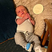 Reuben joined the competition — help win amazing prizes! armchair, baby, blanket, cushion, face, hands, indoor, infant, legs, milestone_card, newborn, one_month, onesie, pants, pillow, portrait, socks, soft_texture, whale_sock, wooden_armrest