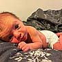 baby, bed, big_eyes, blanket, closeup, cozy, cute, diaper, face, feet, hair, hands, indoor, infant, lying_down, newborn, portrait, skin, soft_texture, staring