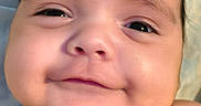 Ramey joined the competition — help win amazing prizes! baby, smiling, face, portrait, cute, child, infant, skin, expression, head, young, chubby_cheeks, hair, lying_down, closeup, adorable, happy, person, soft_background, indoors