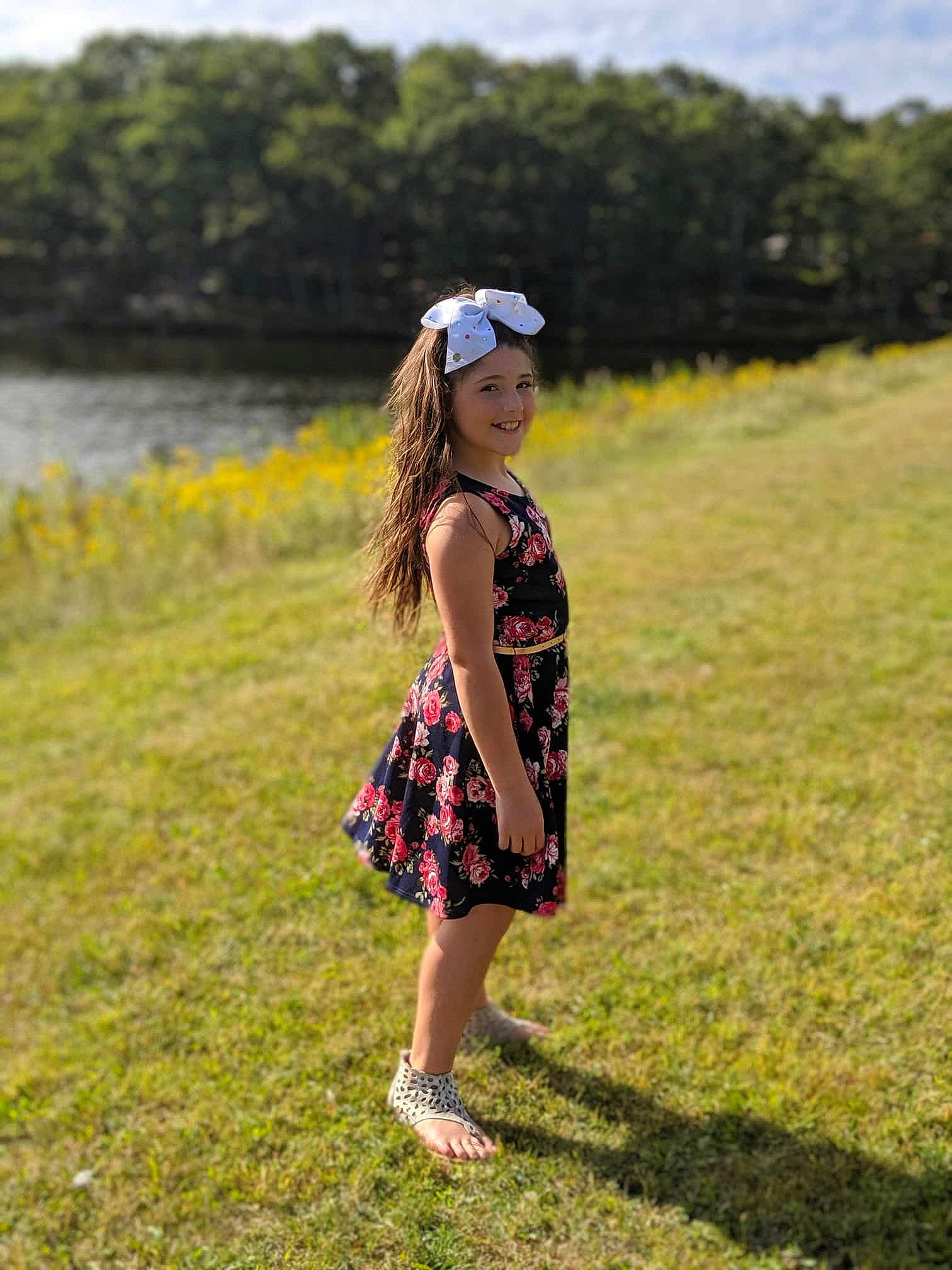 Saoirse joined the competition — help win amazing prizes! beauty, child, clothing, dress, fashion, grass, grass_family, grassland, green, headgear, headwear, joy, long_hair, meadow, pattern, people_in_nature, person, photography, summer, sunlight