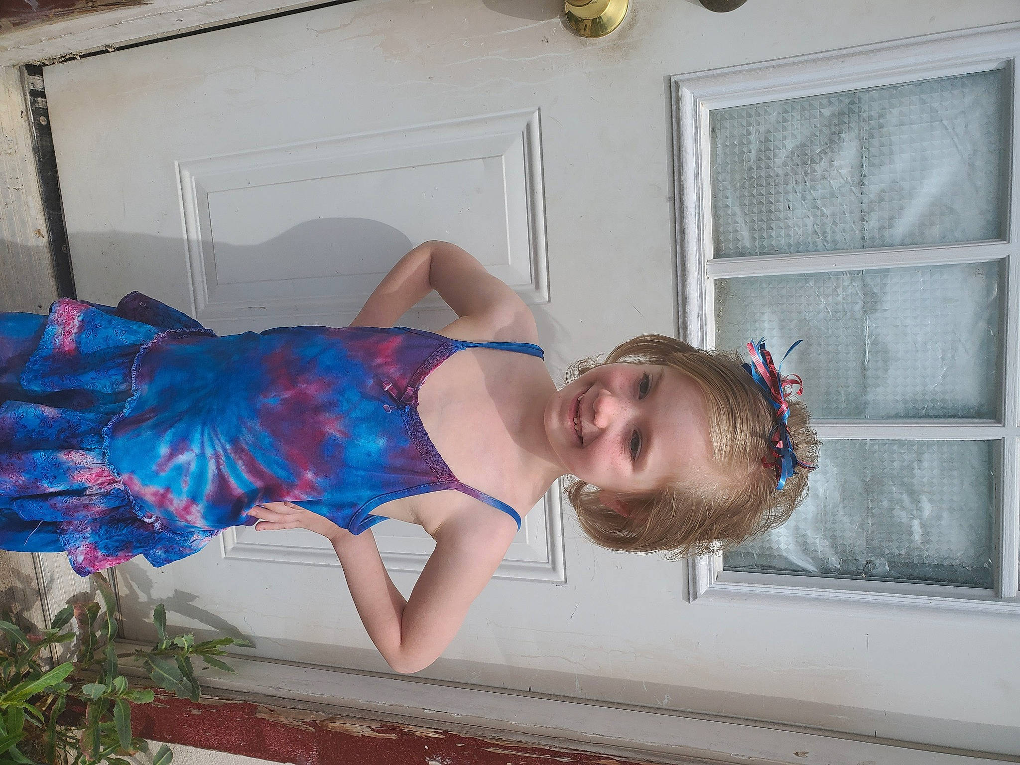 Sapphire is registered to the contest to win money with this photo: abdomen, day_dress, electric_blue, hair_accessory, joy, one_piece_garment, ornament, person, shoulder, throat, waist, window_blind, window_covering, window_treatment