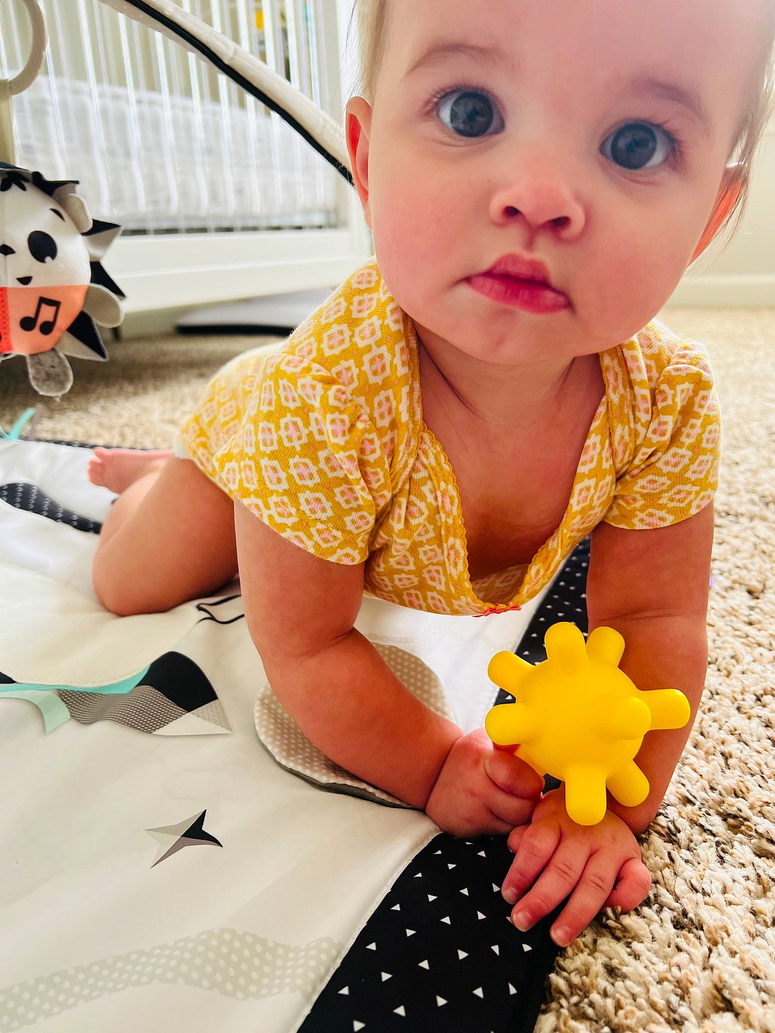 Karlin is registered to the contest to win money with this photo: arm, baby, baby_toddler_clothing, black, child, finger, fun, hairstyle, hand, happy, orange, person, photograph, product, red, skin, textile, toddler, toy, white