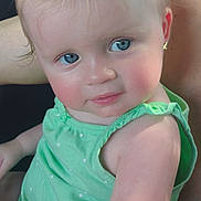 Ariyah joined the competition — help win amazing prizes! child, baby, toddler, portrait, face, blue_eyes, blonde_hair, smiling, rosy_cheeks, green_dress, car, seat, backseat, indoor, close_up, sitting, earring, cute, photography, vehicle