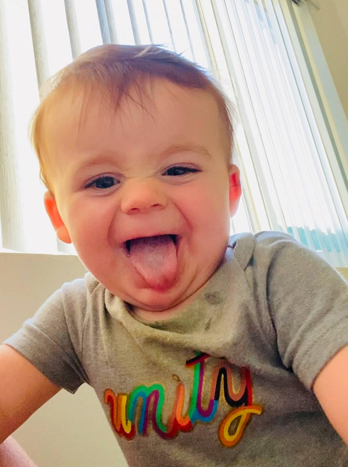 Griffin joined the competition — help win amazing prizes! arm, cheek, chin, clothing, curtain, facial_expression, forehead, hairstyle, head, jaw, lip, mouth, neck, nose, organ, person, shirt, skin, sleeve, smile