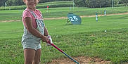 Amiyah joined the competition — help win amazing prizes! child, girl, golf, driving_range, grass, smile, summer, outdoor, overalls, sandals, golf_club, greenery, sport, fun, playing, nature, happy, young, recreation, activity