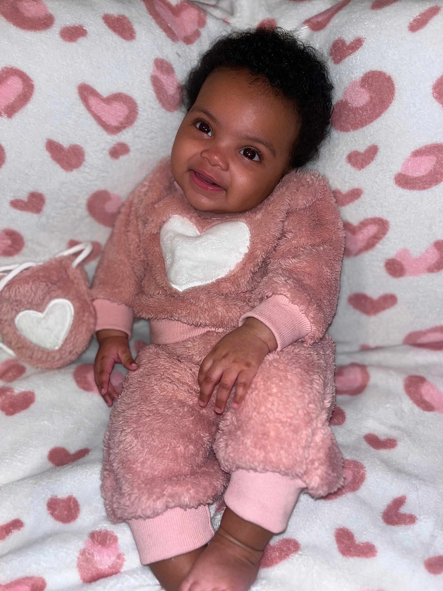 Ameri Tru Bailey is registered to the contest to win money with this photo: baby, blanket, bodypart, clothing, couch, cushion, dress, face, finger, furniture, hand, happy, head, homedecor, indoors, person, photography, portrait, sitting, smile