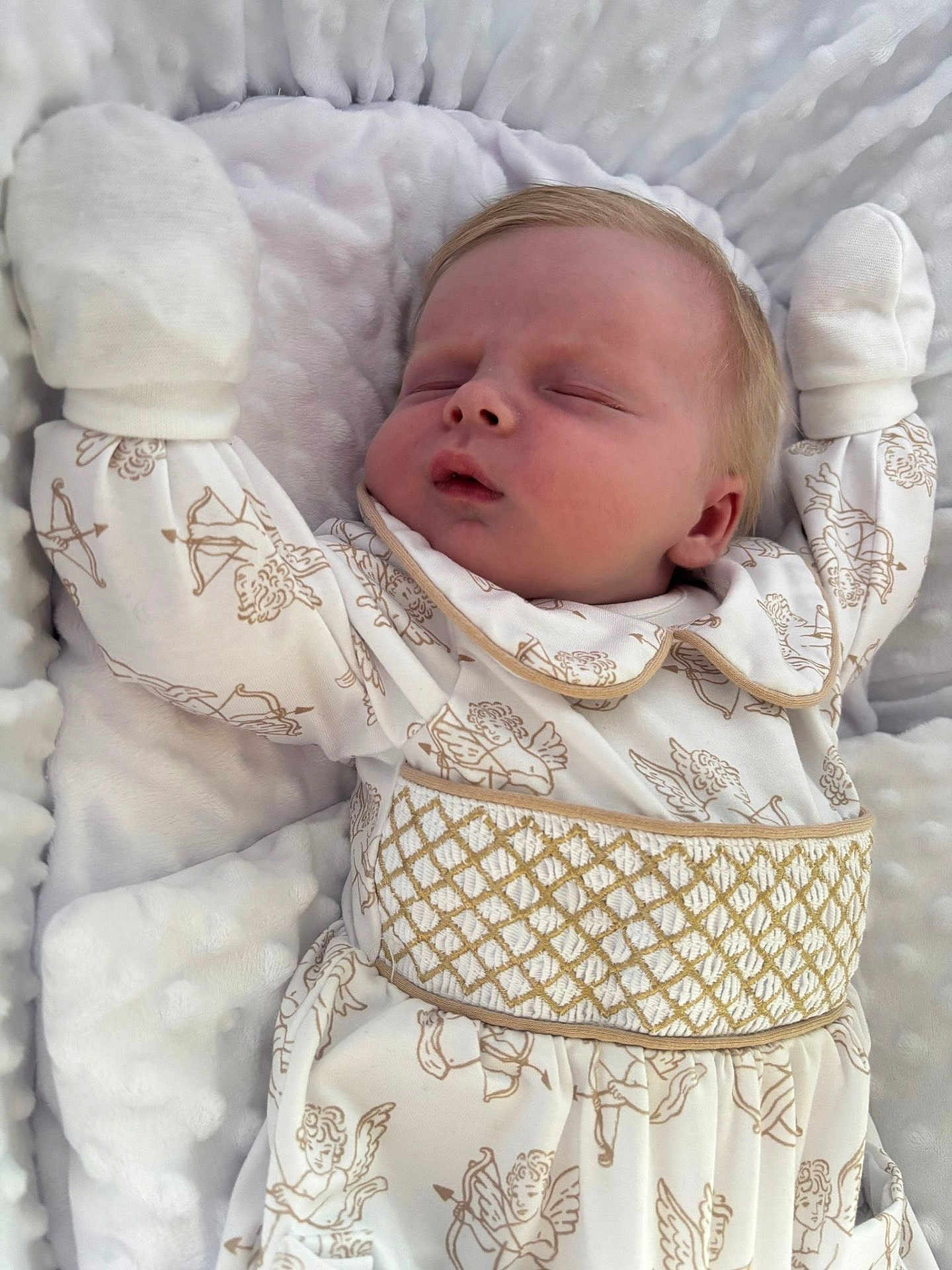 Harland is registered to the contest to win money with this photo: baby, sleeping, infant, blanket, white_clothing, patterned_outfit, cherubs, soft_texture, cozy, cute, peaceful, newborn, portrait, closeup, hands_in_mittens, resting, child, bed, comfort, adorable