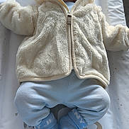 Harland joined the competition — help win amazing prizes! baby, sleeping, infant, clothing, jacket, hat, blue, cream, sock, changing_mat, cute, cozy, indoor, soft, padded, peaceful, face, newborn, child, resting
