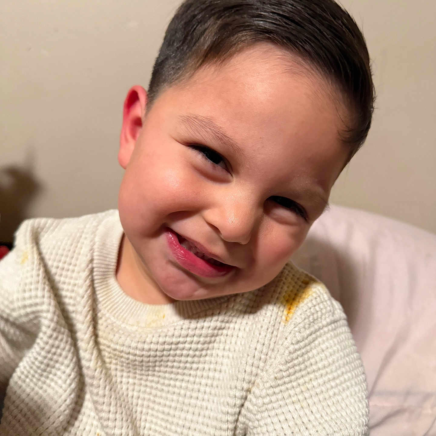 Gerardo is registered to the contest to win money with this photo: child, smile, face, hair, sweater, cozy, portrait, indoor, cute, expression, skin, person, head, happy, young, fashion, texture, warm, casual, closeup