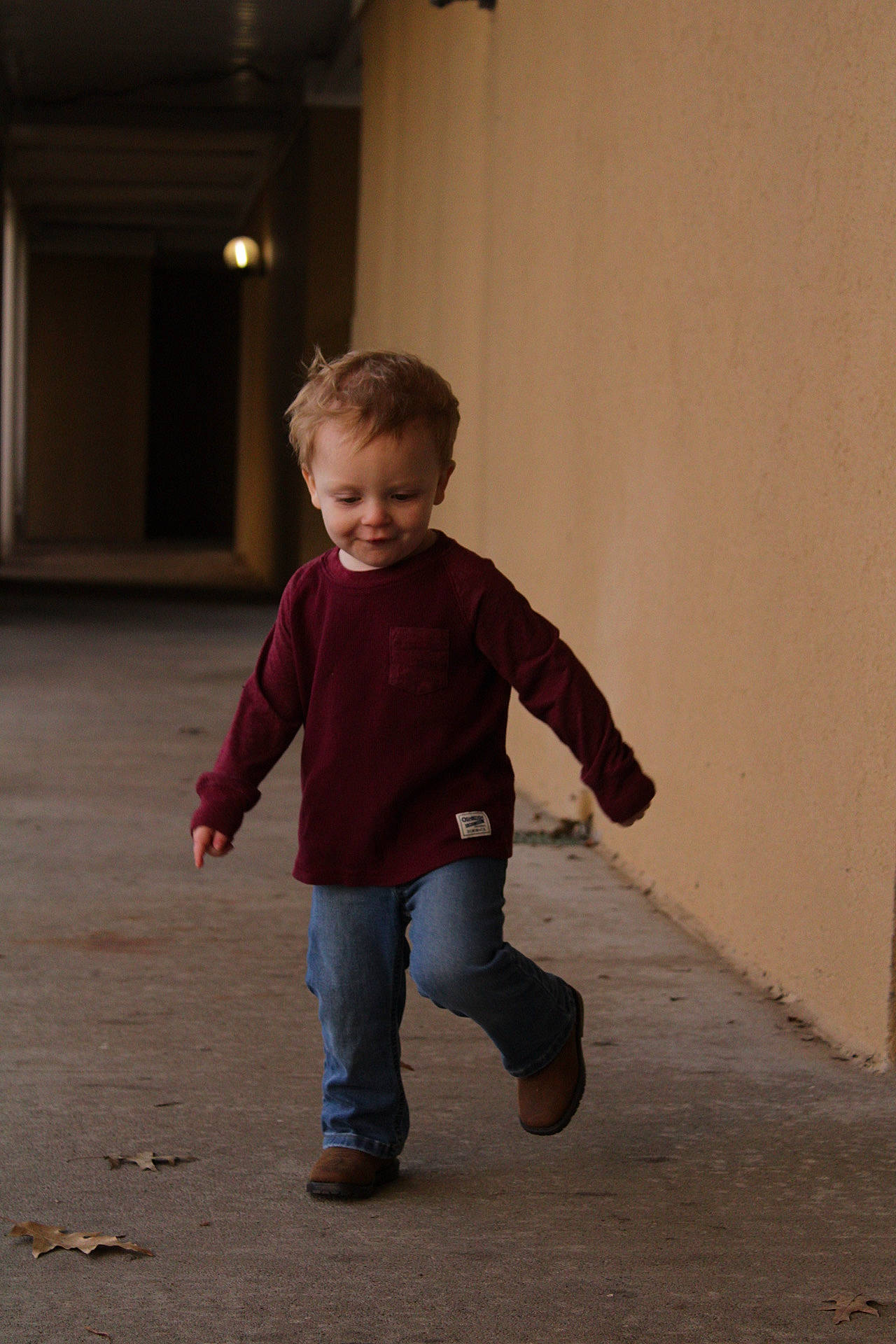 Haiden is registered to the contest to win money with this photo: balance, child, concrete, denim, door, eye, floor, flooring, foot, fun, gesture, hair, happy, joy, leg, person, recreation, sleeve, smile, toddler