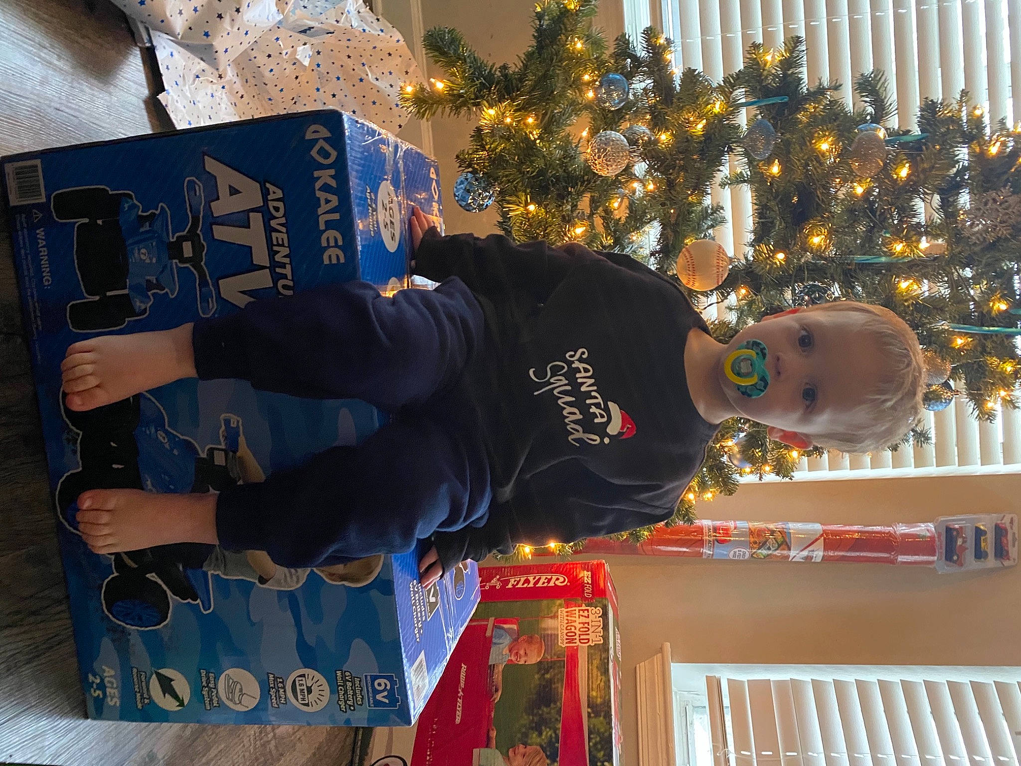 Haiden is registered to the contest to win money with this photo: christmas, christmas_decoration, christmas_eve, christmas_ornament, christmas_tree, conifer, event, fun, happy, hat, holiday, holiday_ornament, interior_design, joy, ornament, person, plant, sleeve, tradition, tree
