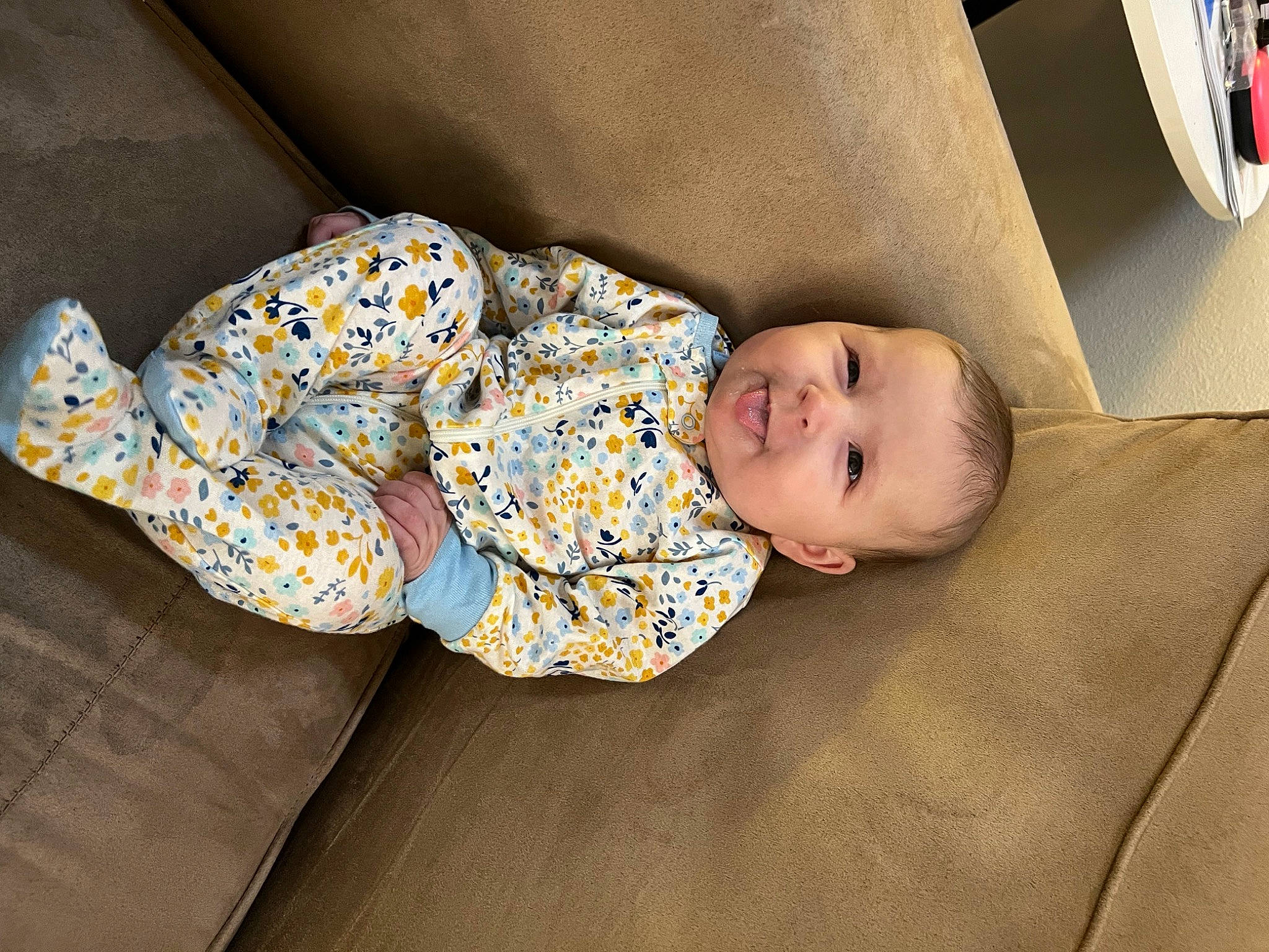 Nevada joined the competition — help win amazing prizes! baby, baby_toddler_clothing, child, comfort, couch, floor, flooring, foot, hardwood, human_leg, linens, pattern, person, room, sitting, sleep, sleeve, smile, sock, toddler