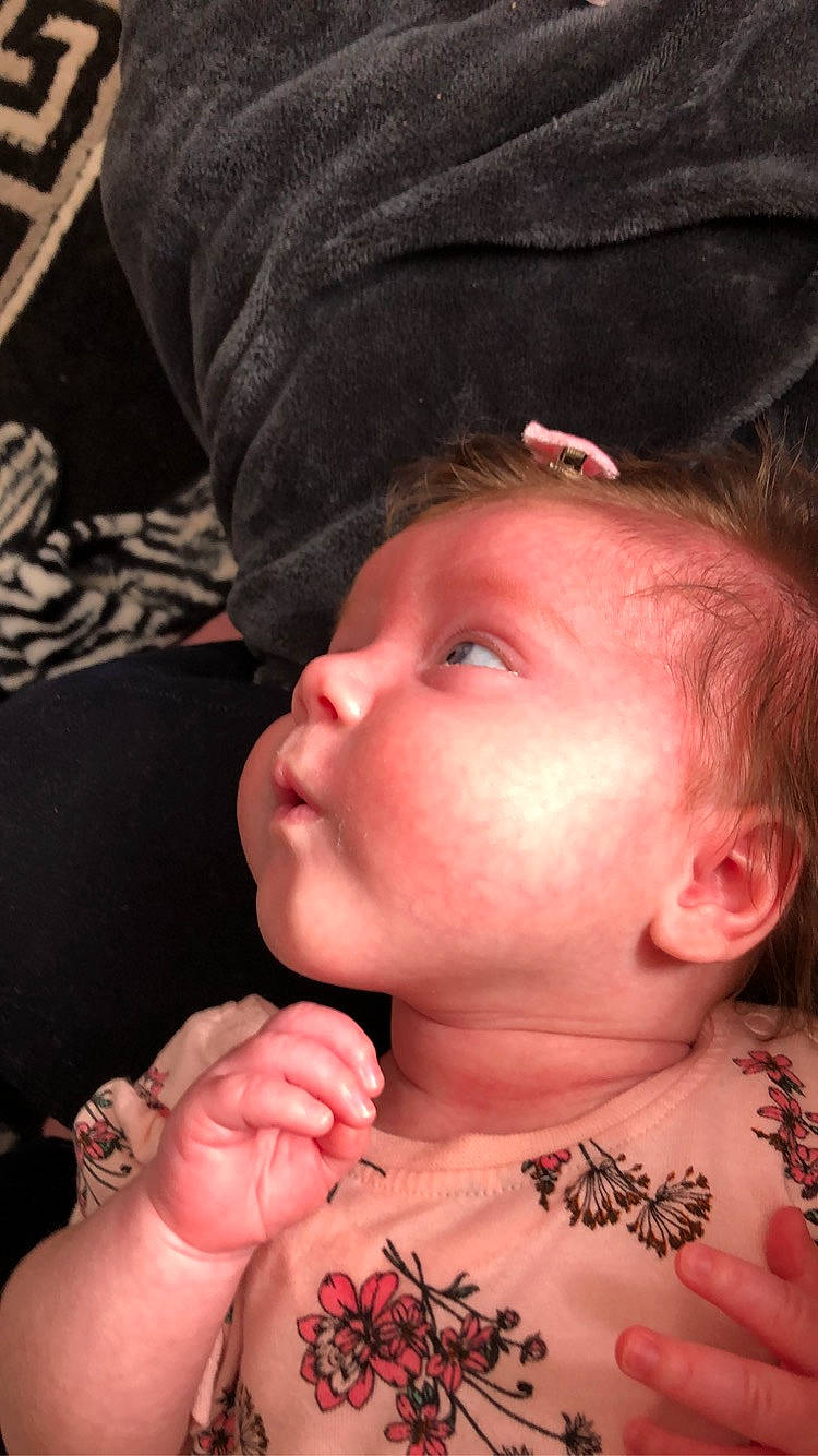 Cheyanne is registered to the contest to win money with this photo: arm, baby, cheek, child, chin, ear, eye, face, finger, forehead, hand, head, lip, mouth, muscle, neck, nose, person, pink, skin