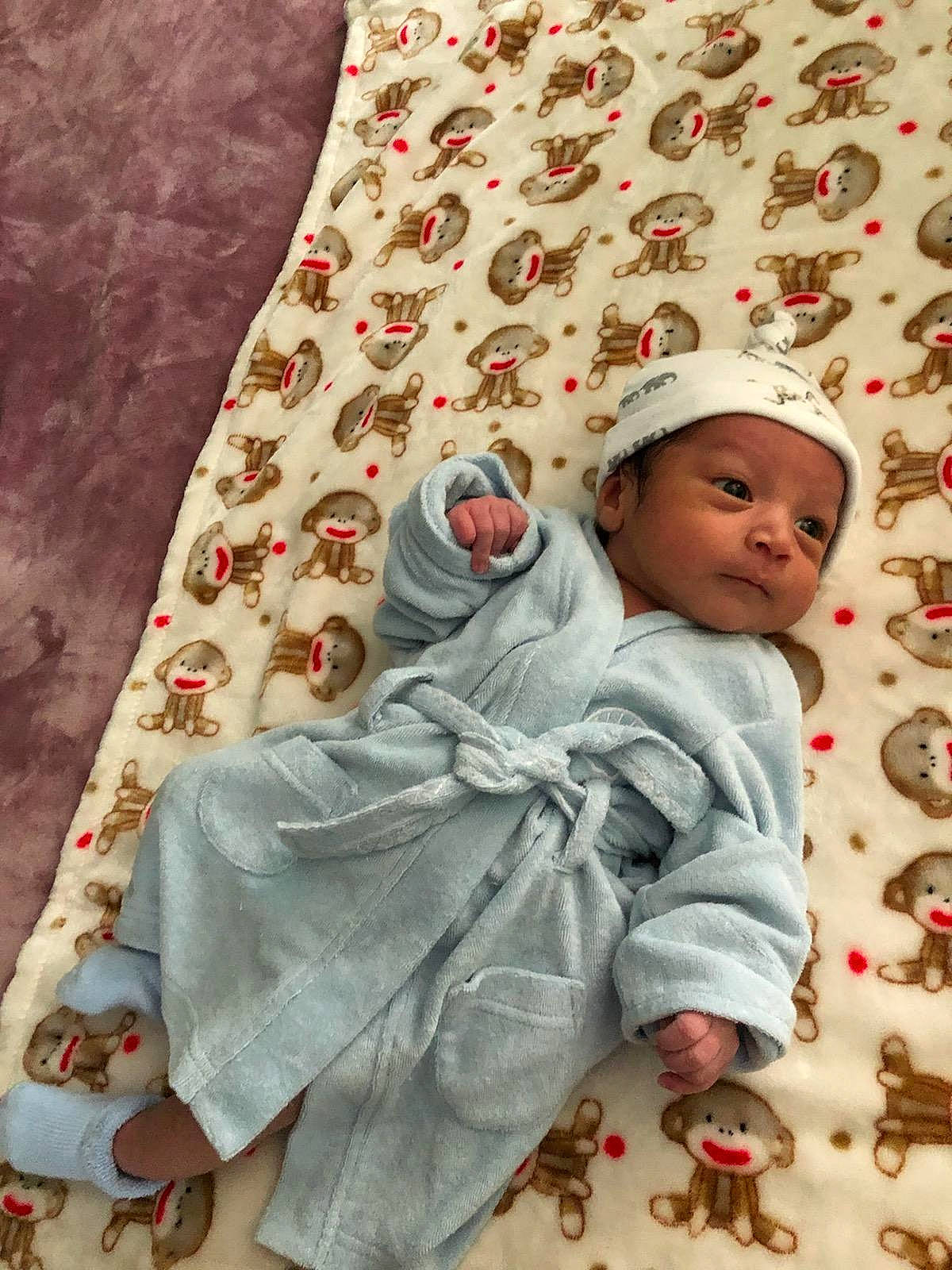 Ritchie is registered to the contest to win money with this photo: baby, child, headwear, linens, person, textile, toddler