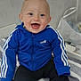 Eddy a rejoint le concours — aidez-le/la à gagner de superbes lots ! baby, child, smiling, blue_jacket, adidas, sitting, indoor, towel, striped, happy, face, clothing, socks, pants, person, cute, young, infant, portrait, casual