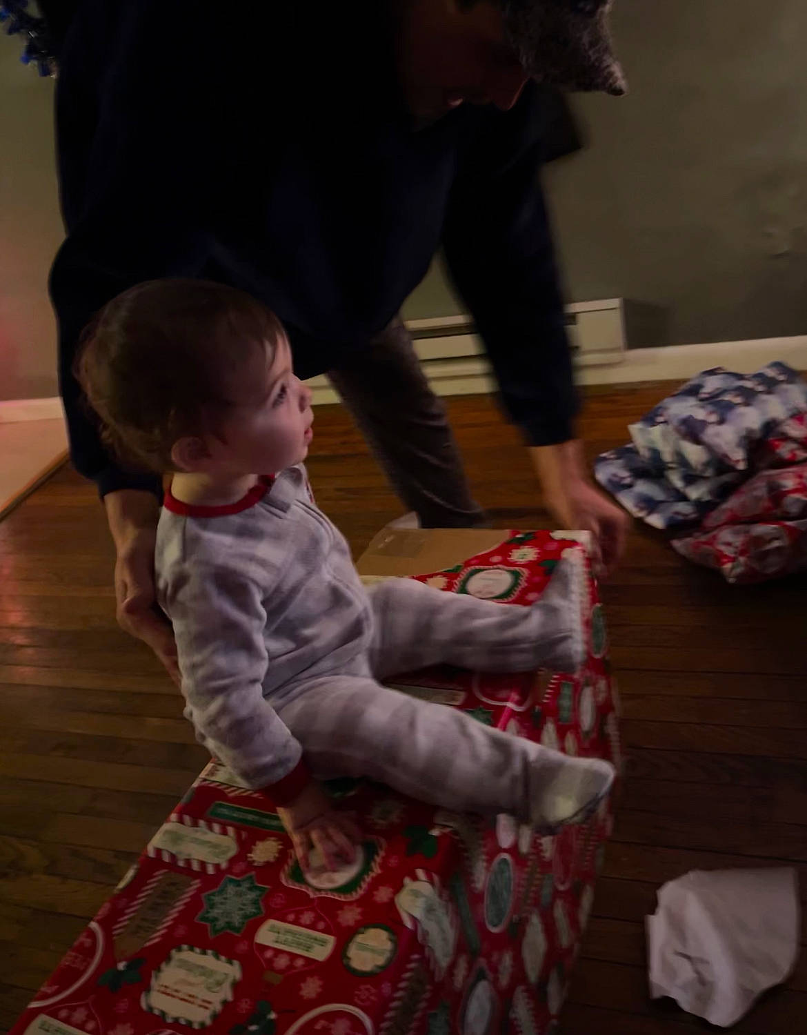 Arya joined the competition — help win amazing prizes! baby, baby_toddler_clothing, black, carmine, child, christmas, comfort, event, floor, flooring, fun, holiday, human, lap, linens, pattern, person, room, sitting, toddler