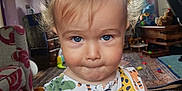 Elijah Blue joined the competition — help win amazing prizes! animal_print, blue_eyes, carpet, child, colorful_clothing, curly_hair, curtains, cute, expression, furniture, indoor, lamp, living_room, playful, portrait, sofa, toddler, toys, window, wooden_floor